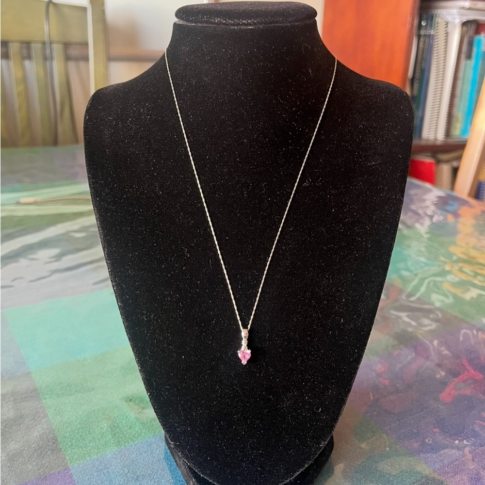 10 K white gold chain and pendant with heart shaped gem.